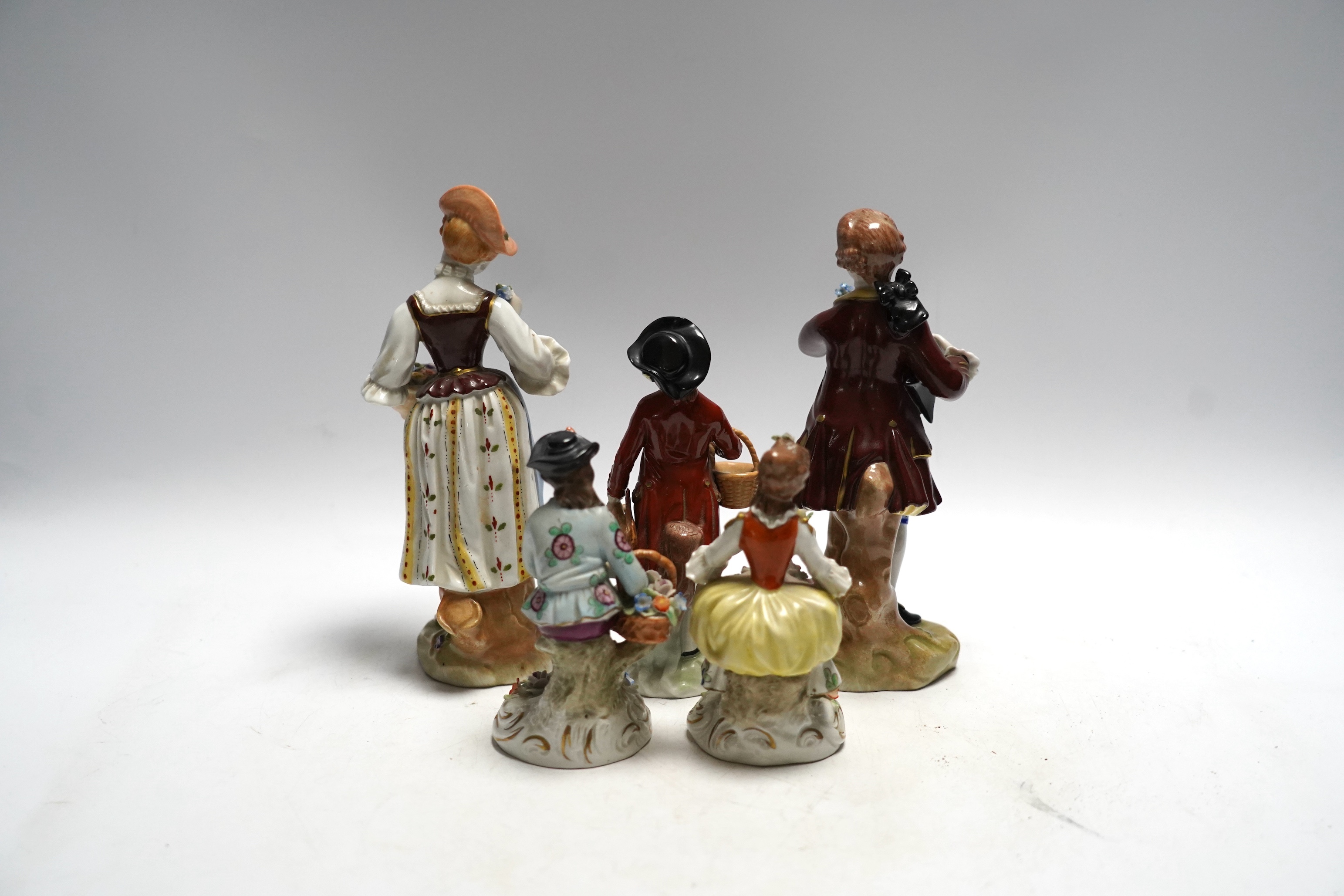 Three Dresden and two Sitzendorf porcelain figures, tallest 20cm